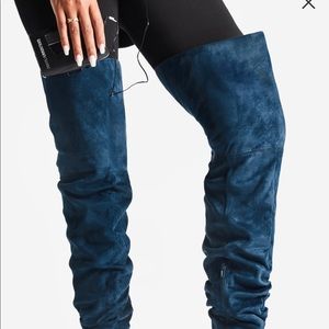 Teal boots- new in still in the box. Never worn